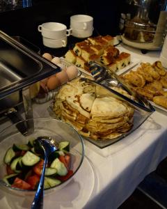 a table topped with a buffet of food at Hotel "CONTINENT" halal in Karagandy