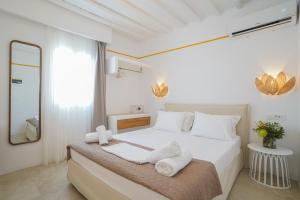 Postel nebo postele na pokoji v ubytování 23 Hotel Mykonos