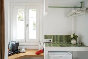 Kuchyň nebo kuchyňský kout v ubytování 23 Hotel Mykonos