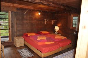 מיטה או מיטות בחדר ב-Baita Prato Della Croce
