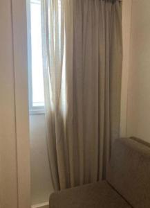 a window with a curtain in a room at S4 HOTEL Aguas Claras TorresReis in Brasilia