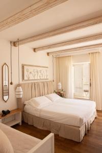 a bedroom with two beds and a window at Masseria Bandino & Spa in Otranto