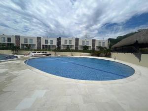 Bazén v ubytování Cómoda casa en condominio para descansar nebo v jeho okolí