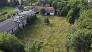an aerial view of an old building on a field at Mieszkanie na wsi in Trzebiel