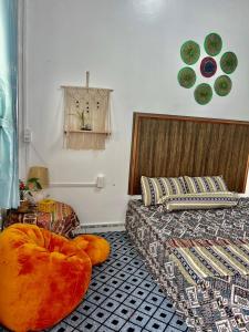 a bedroom with a bed and a large pumpkin on the floor at AKa HomeStay in Yên Minh