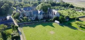 an aerial view of a large castle on a green field at Maison de rêve en plein coeur de Paimpol in Paimpol