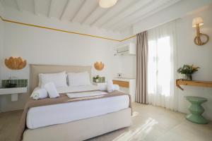Postel nebo postele na pokoji v ubytování 23 Hotel Mykonos