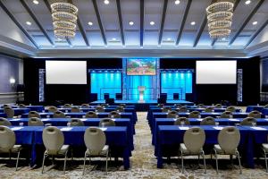 a room with blue tables and chairs and a stage at Grand Hotel Golf Resort & Spa, Autograph Collection in Point Clear +121 photos