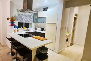 a kitchen with a white counter and a sink at Unobstructred seaviews, 2BR, Kingbeds, Fully ACd in Marsaskala