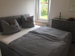 Postel nebo postele na pokoji v ubytování Bungalow 28 "Auszeit"