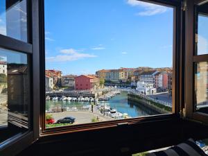 a view of a river from a window at Hotel Puerto Rico in Llanes