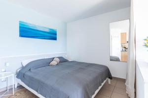 Postel nebo postele na pokoji v ubytování Haus Seeblick Wohnung 12 Easy Ocean