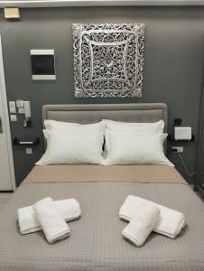 Ένα ή περισσότερα κρεβάτια σε δωμάτιο στο Kentrikon Guest House