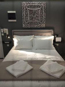 Postel nebo postele na pokoji v ubytování Kentrikon Guest House