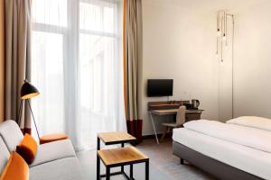 Postel nebo postele na pokoji v ubytování Vienna House Easy by Wyndham Trier