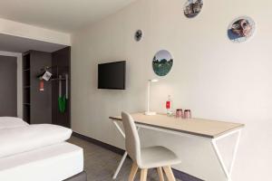 TV a/nebo společenská místnost v ubytování Vienna House Easy by Wyndham Trier