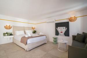 Postel nebo postele na pokoji v ubytování 23 Hotel Mykonos