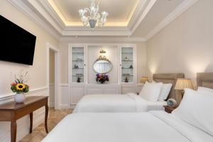 Ένα ή περισσότερα κρεβάτια σε δωμάτιο στο King George, a Luxury Collection Hotel, Athens