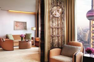 a hotel lobby with a view of the city at The Ritz-Carlton Shanghai, Pudong in Shanghai