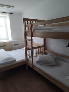 two bunk beds in a room with a window at Cool Traveler in Kyiv