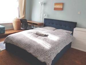 a bedroom with a bed and a desk and a chair at Bloomsbury 2 room flat in London