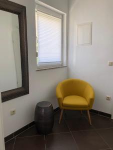 Posezení v ubytování Kavajin Rooms