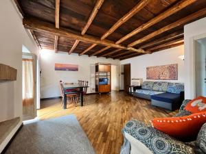 a living room with a couch and a table at Kibilù - Via Robarello - Sacro Monte in Varese