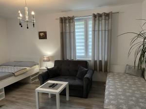 Posteľ alebo postele v izbe v ubytovaní NONIEWICZA CENTRUM