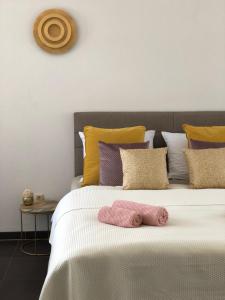 Postel nebo postele na pokoji v ubytování Kavajin Rooms