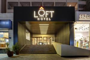 a building with a sign that reads off the hotel at THE LOFT HOTEL By BRATUS in Aqaba