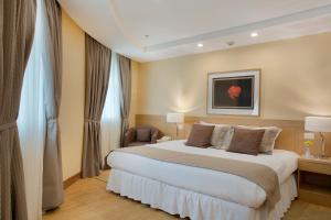 Cama ou camas em um quarto em Windsor Florida Hotel