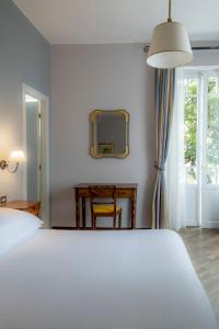 Postel nebo postele na pokoji v ubytování Albergo Ristorante Il Verbano