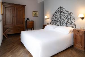 Postel nebo postele na pokoji v ubytování Albergo Ristorante Il Verbano