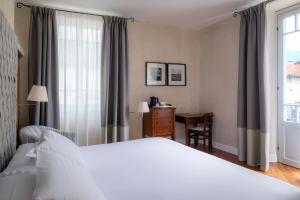 Postel nebo postele na pokoji v ubytování Albergo Ristorante Il Verbano