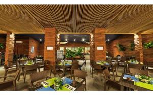 a dining room with tables and chairs in a restaurant at Astoria Palawan 3 in Rizal