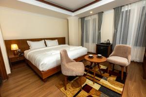 Voodi või voodid majutusasutuse Darbar Heritage Inn toas