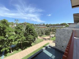 una vista desde el techo de una casa con árboles en ILE DE PIPA Soé - By Almare Flats, en Pipa