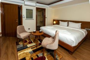 Voodi või voodid majutusasutuse Darbar Heritage Inn toas