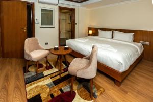 Voodi või voodid majutusasutuse Darbar Heritage Inn toas