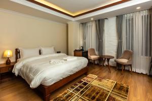Voodi või voodid majutusasutuse Darbar Heritage Inn toas
