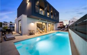 a swimming pool in the backyard of a house at Gorgeous Home In Vodice With Sauna in Vodice