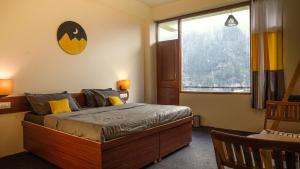 Giường trong phòng chung tại Firefly Hostel