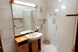 a bathroom with a sink and a shower at *Piazza Italia* Vicino Autostrada*Roma 40 min.* in Orte