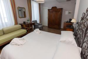 Postel nebo postele na pokoji v ubytování Albergo Ristorante Il Verbano