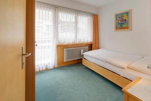 Postel nebo postele na pokoji v ubytování Hotel Parnass