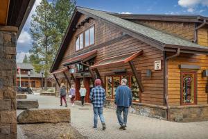 a group of people walking in front of a building at Aquila Lodge - Unit 5 in Sunriver