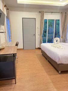 Koh Yao Modern Inn -SHA Plus客房内的一张或多张床位