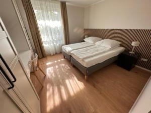 Postel nebo postele na pokoji v ubytování ELBI Apartment