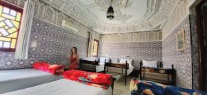 Postel nebo postele na pokoji v ubytování Riad Marrakech Medina