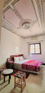 Postel nebo postele na pokoji v ubytování Riad Marrakech Medina